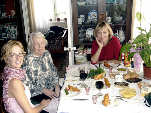 Authors at dining table with Russian food
