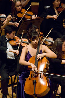 Cellist and symphony on stage at Schwartz Center
