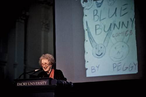Atwood on stage with a childhood drawing
