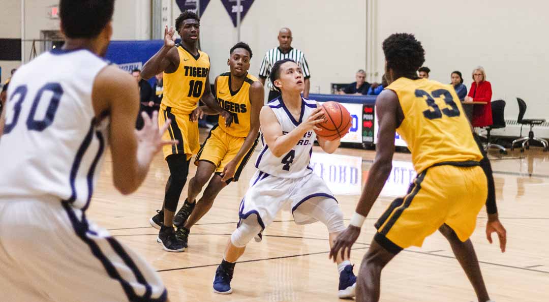 men's basketball team playing on court