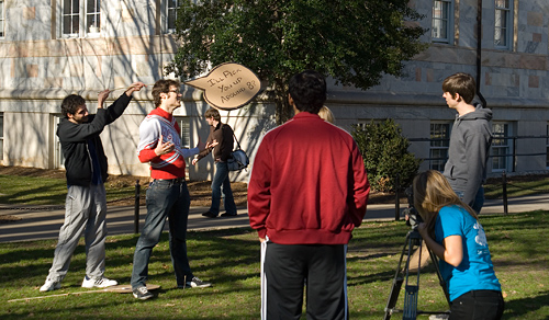 Students filming on the Quad