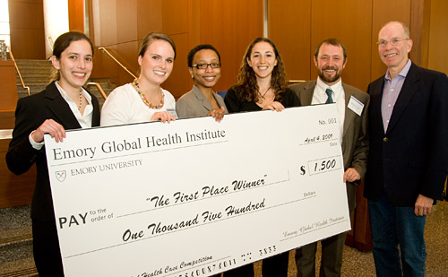 Group photo of winning team with large check