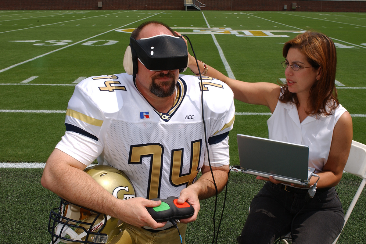  LaPlaca using the DETECT device on a Georgia Tech football player