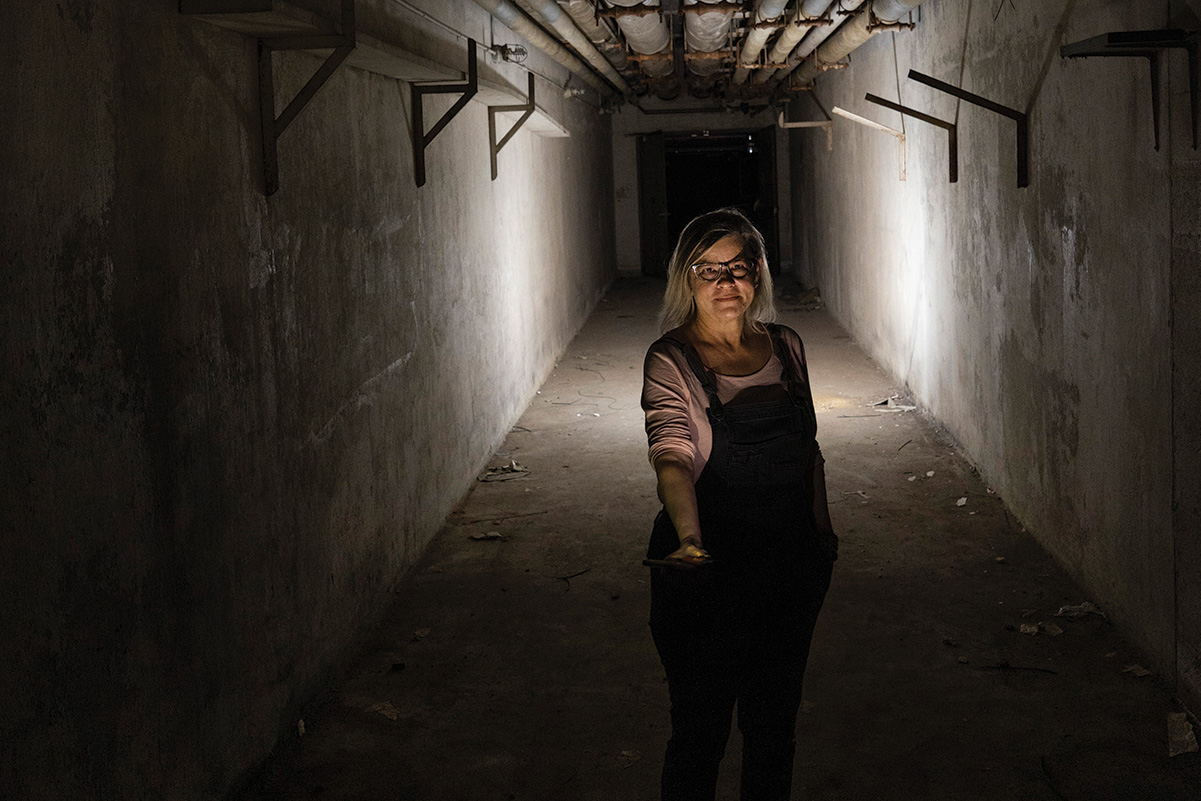 A portrait of Denise Chandler in a tunnel at Briarcliff Campus
