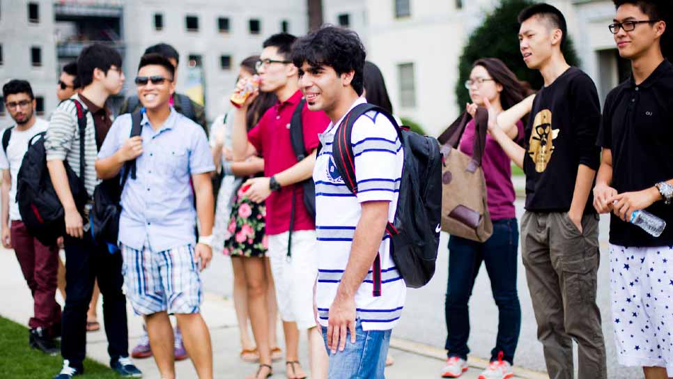 international students talking in quad