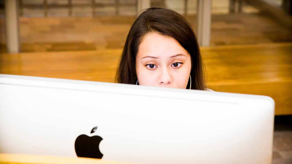 female student working on laptop