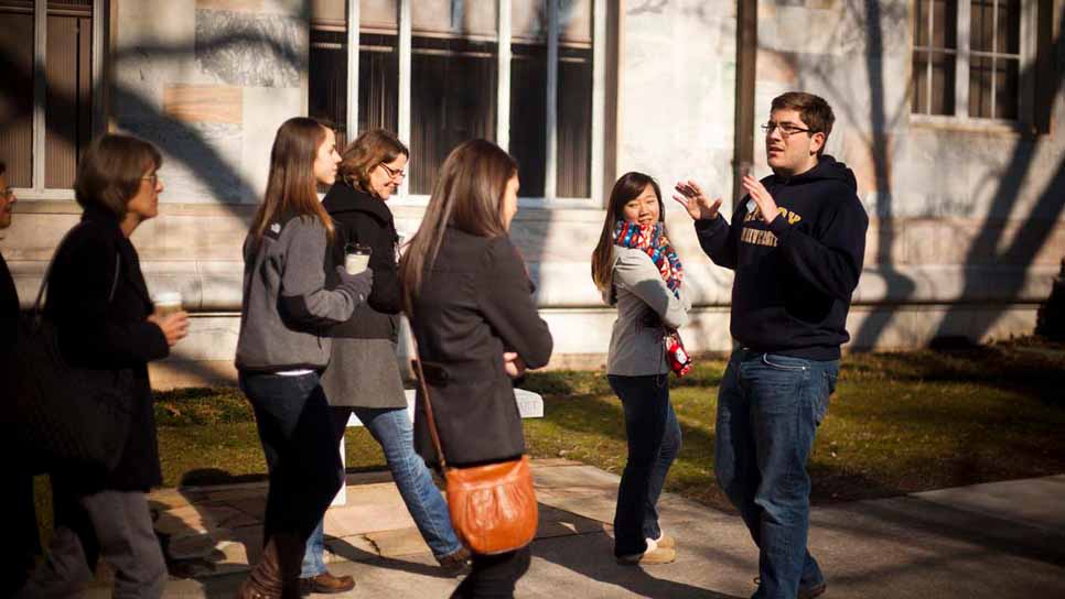 student leading a campus tour