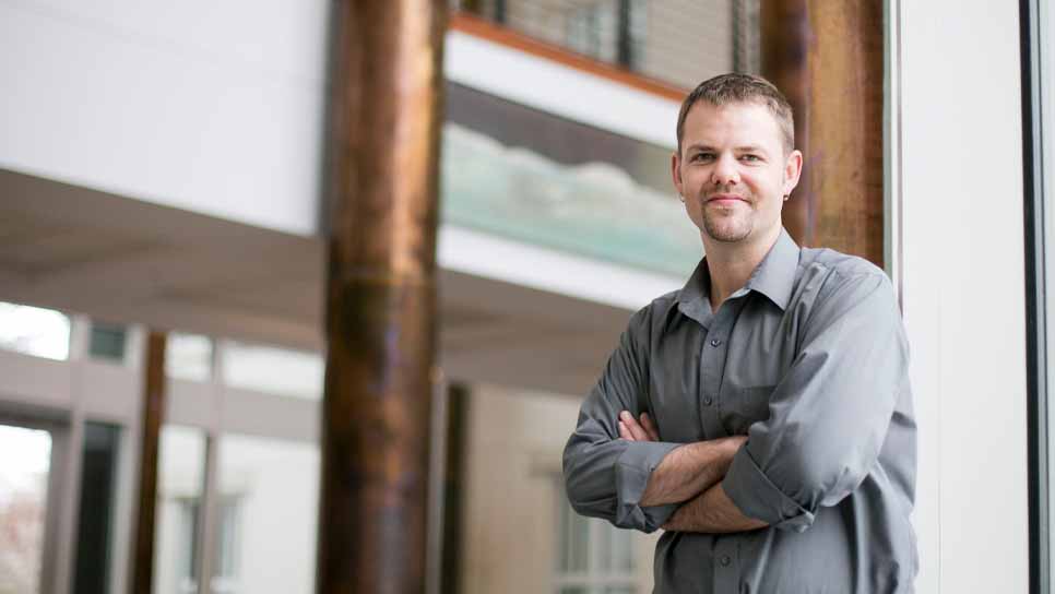 justin burton outside academic building