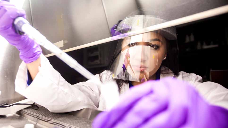 researcher with a syringe