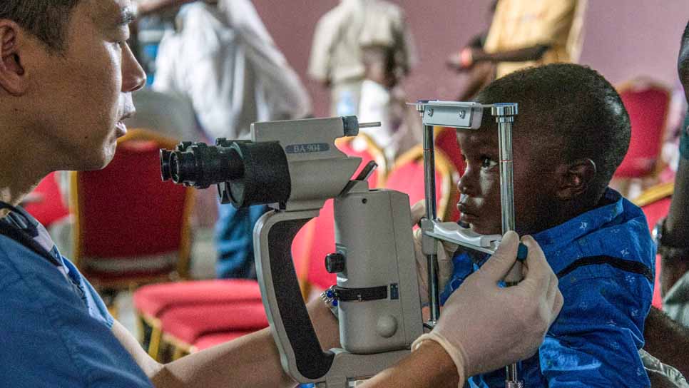 man with microscope doing research