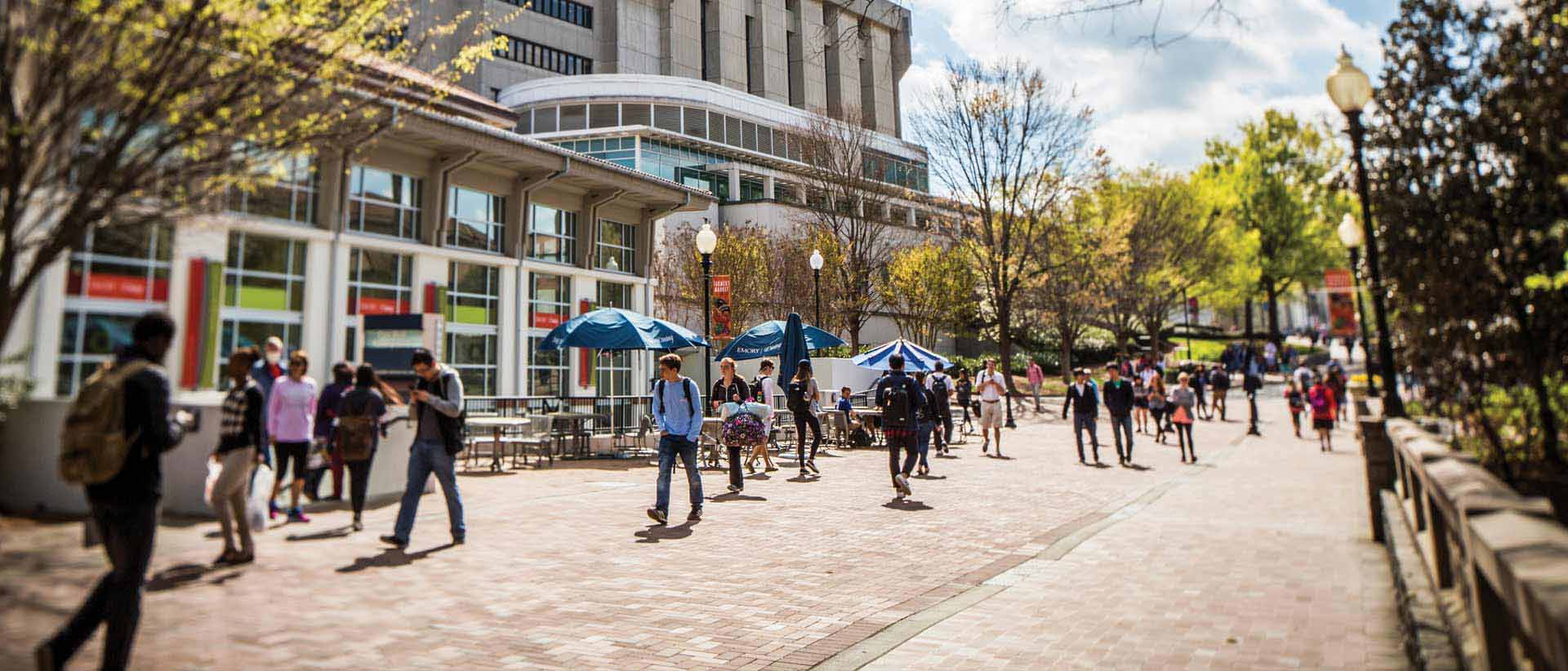 students walking on campus by cox hall