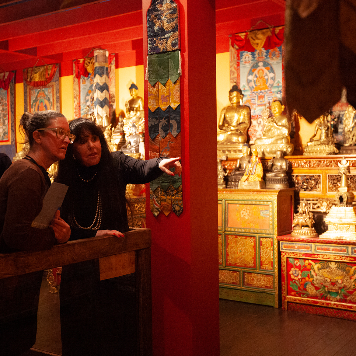 two women looking at an exhibit in the museum