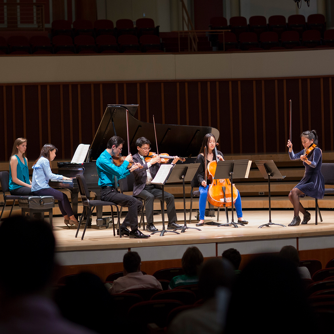 chamber music group rehearsing on stage