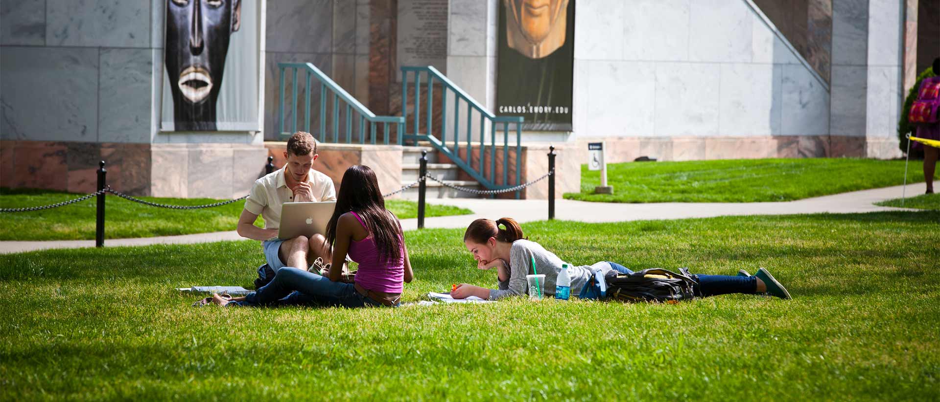 students studying on quad in front of carlos museum