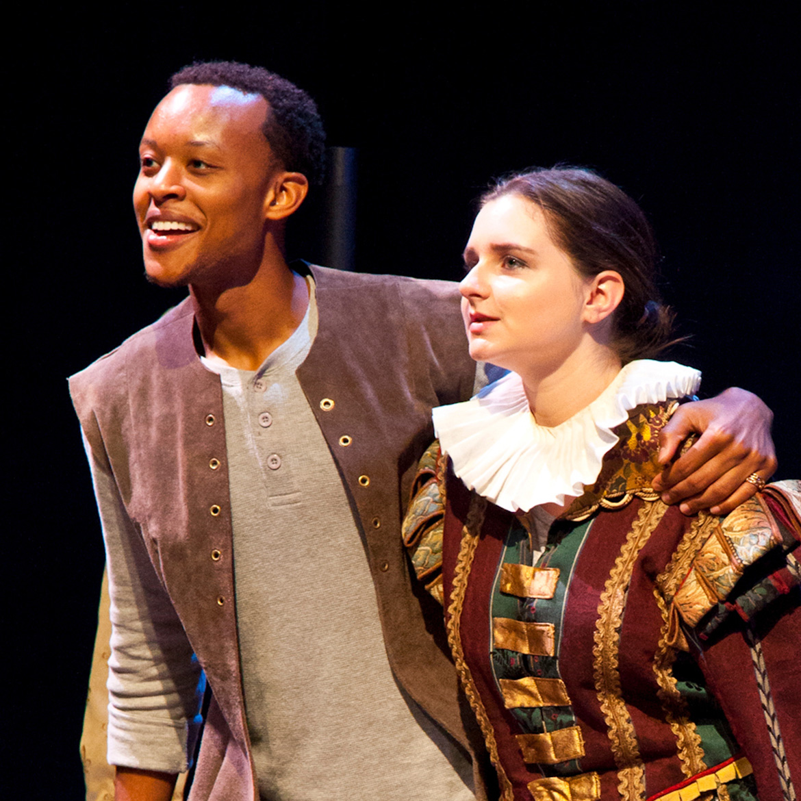 students on stage acting in period costumes