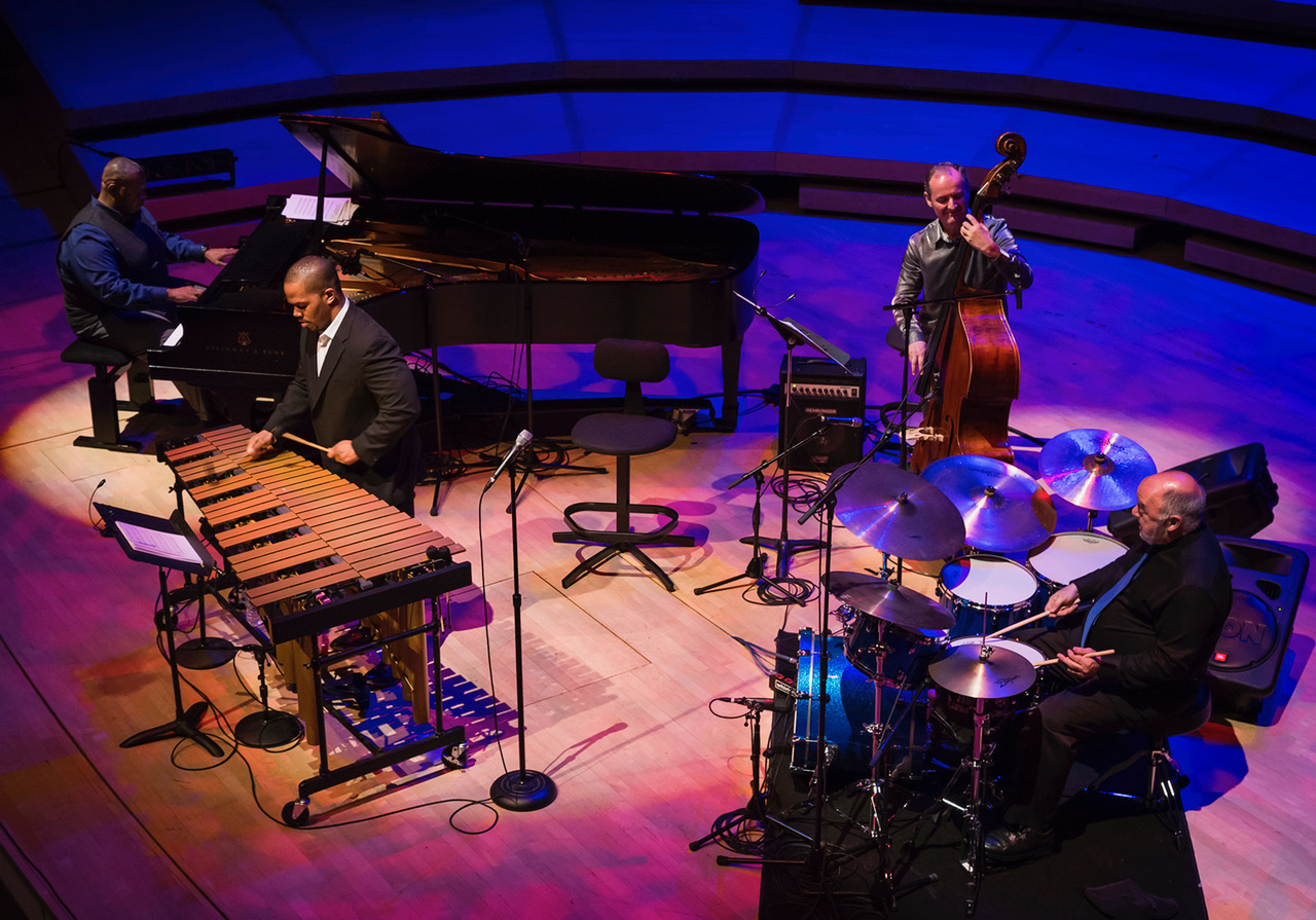 jazz ensemble performing under purple lights