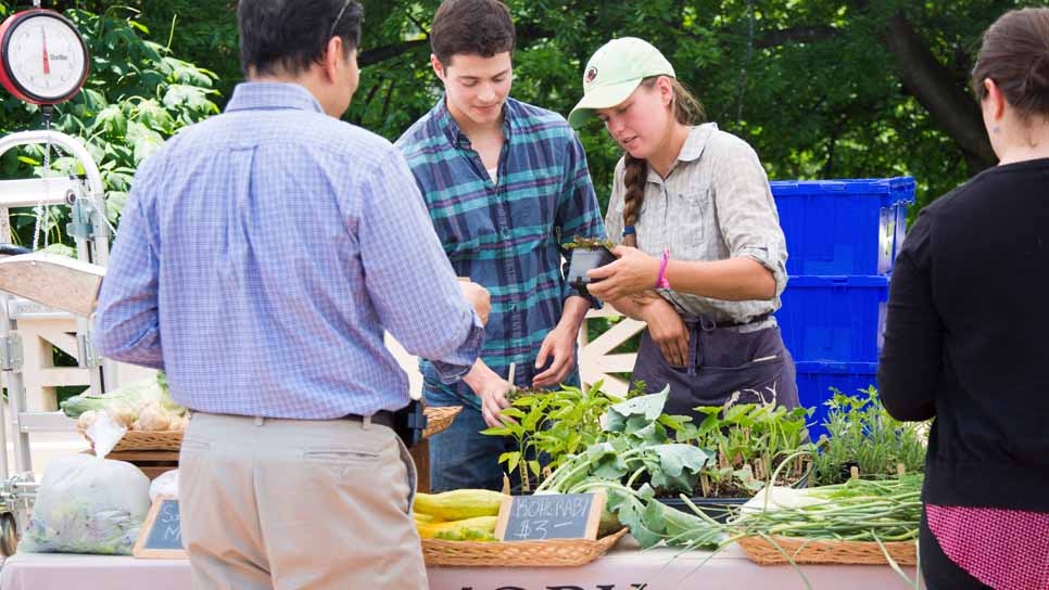 man buying food at the campus farmers market
