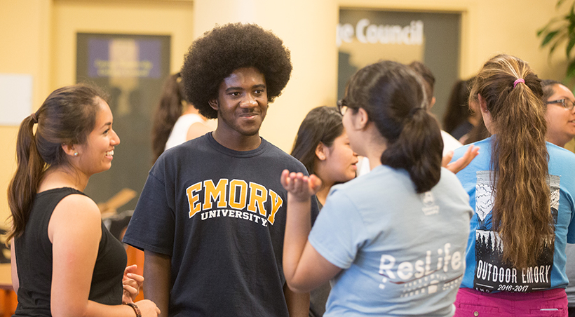 group of students talking and smiling