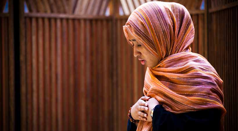 woman in profile with scarf on her head