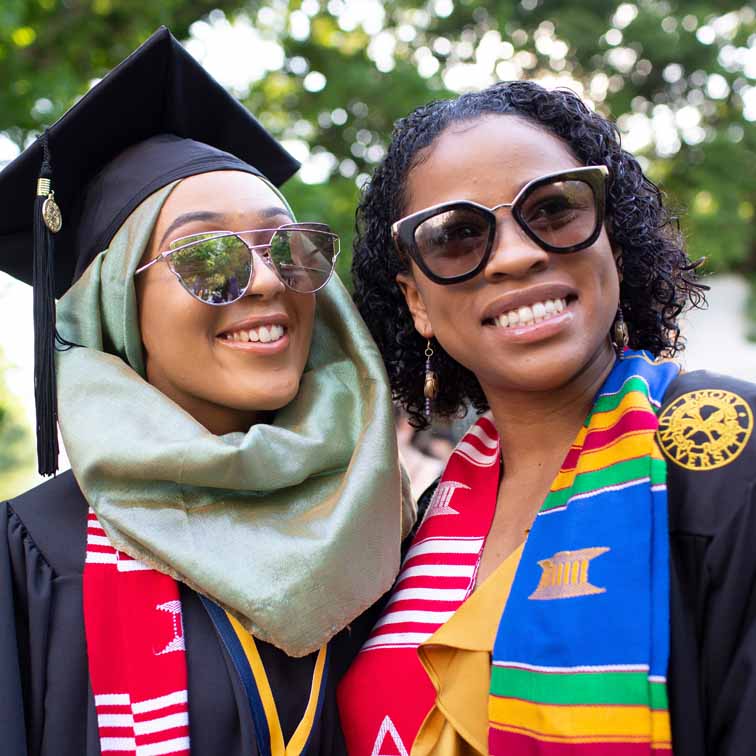 graduating female students posing