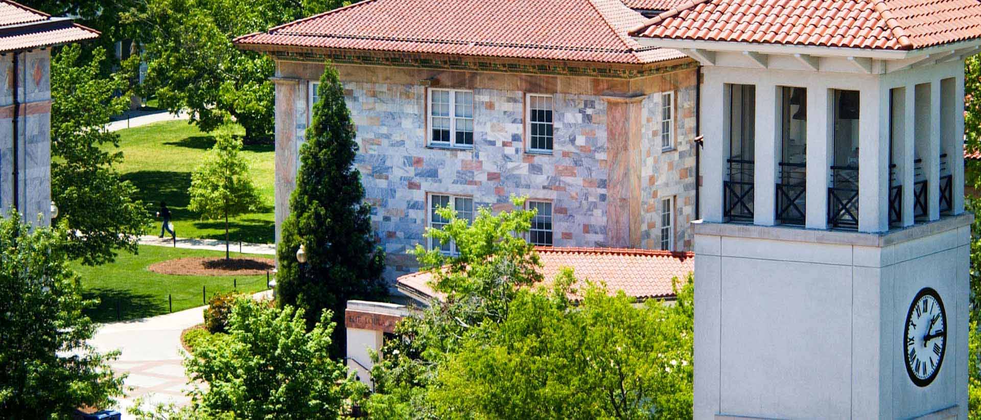 aerial view of cox hall tower with green grass of quad behind