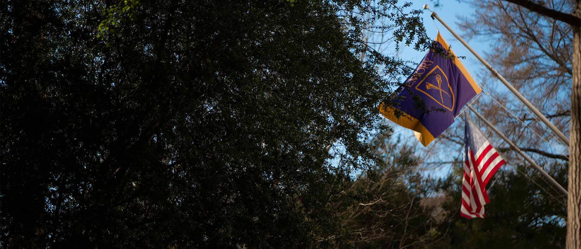 emory and us flag flying over quad