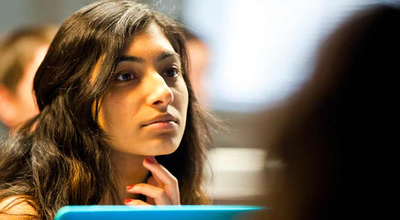 close-up of a student in class listening to lecture