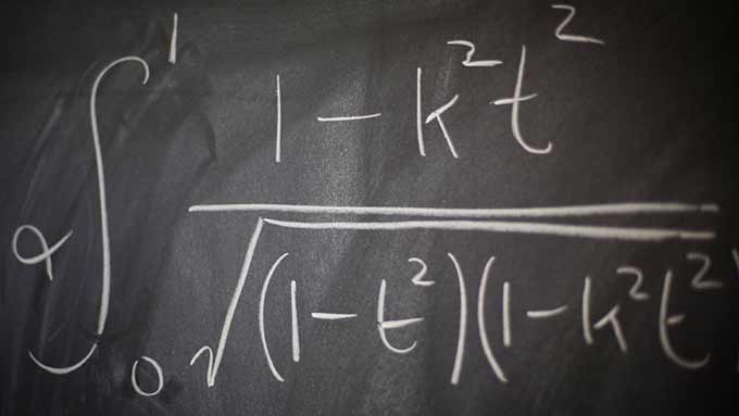 a math equation written on a chalkboard