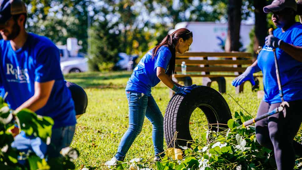 students volunteering outside