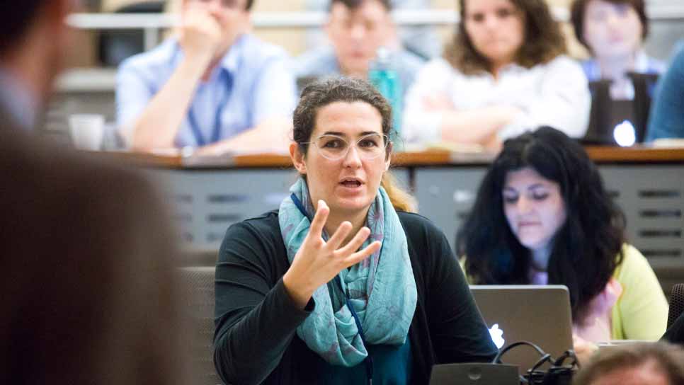 student speaking in lecture hall