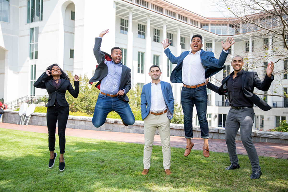 A group photo of student leaders of the Peachtree Minority Venture Fund jumping at the same time