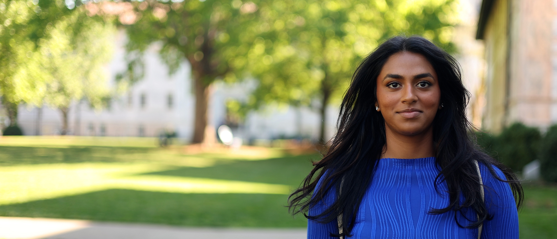 An Emory student stands on the Quad