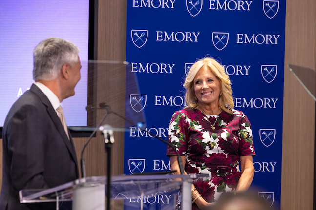 First Lady Jill Biden approaches the podium to speak, introduced by Emory President Gregory L. Fences