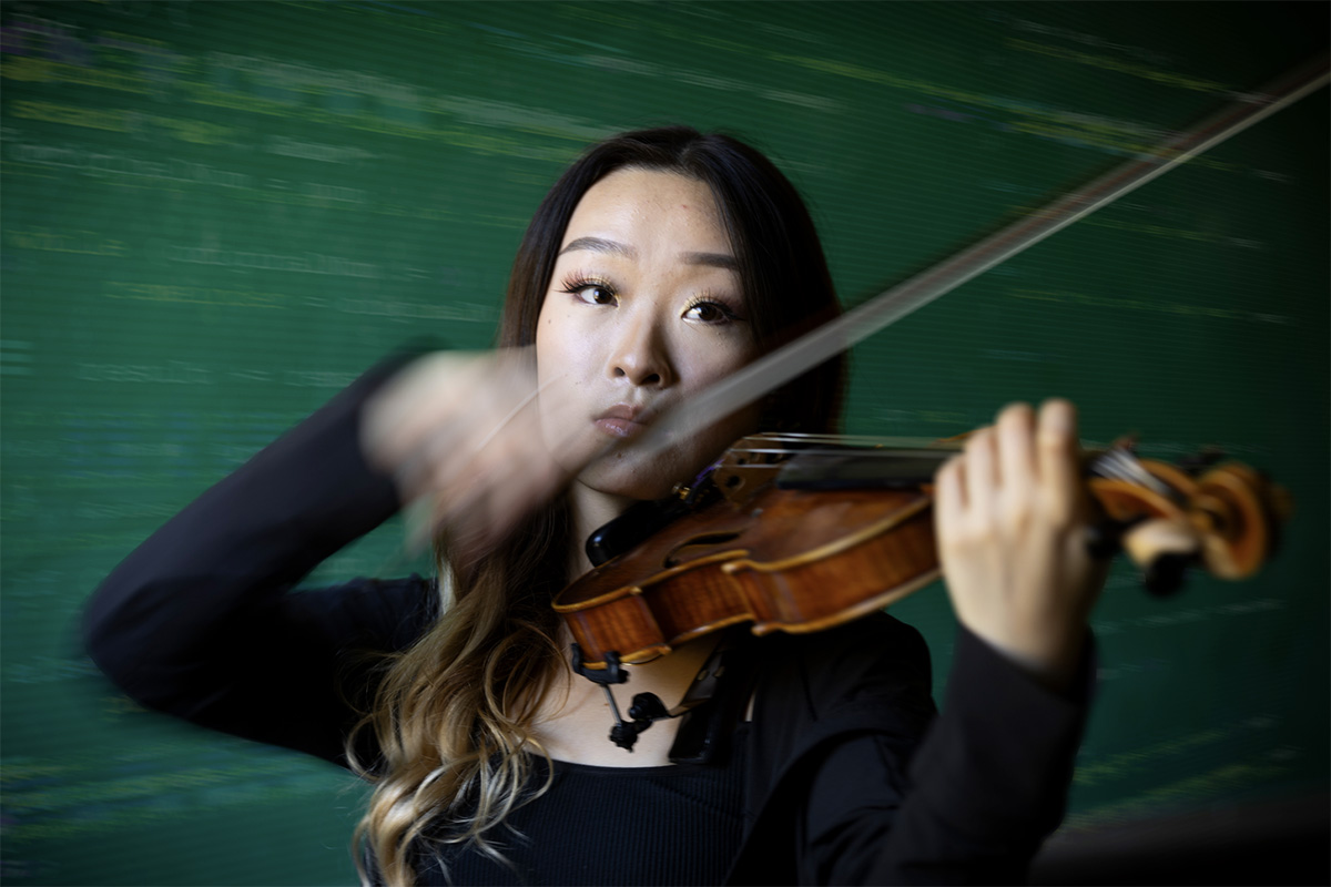a student plays the violin